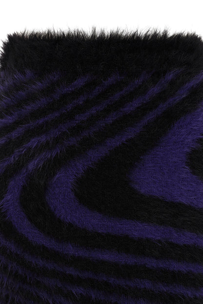 Close-up of the plush black and deep purple swirl pattern of the Daphne Mini Skirt, emphasising its unique gothic aesthetic and comfortable fit.