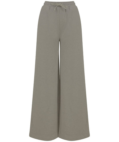 Flat lay of sustainable wide-leg joggers laying on a textured surface, emphasising their relaxed fit and stylish design made from regenerated cotton and recycled polyester.