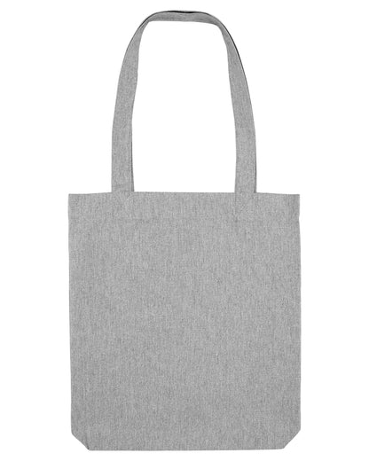Lifestyle image of the luxurious woven tote bag being carried, exuding sophistication and versatility for any occasion.