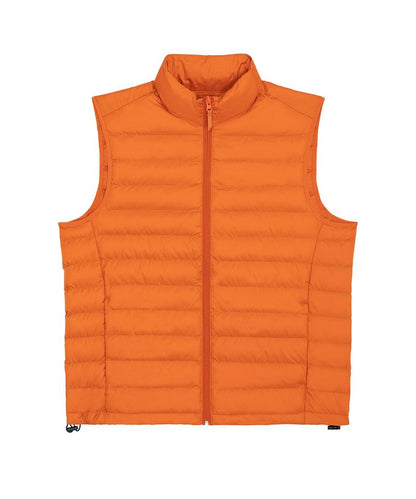 Elegant model wearing a sustainable recycled polyester men's puffer bodywarmer, demonstrating its chic layering ability for a sophisticated outdoor look.