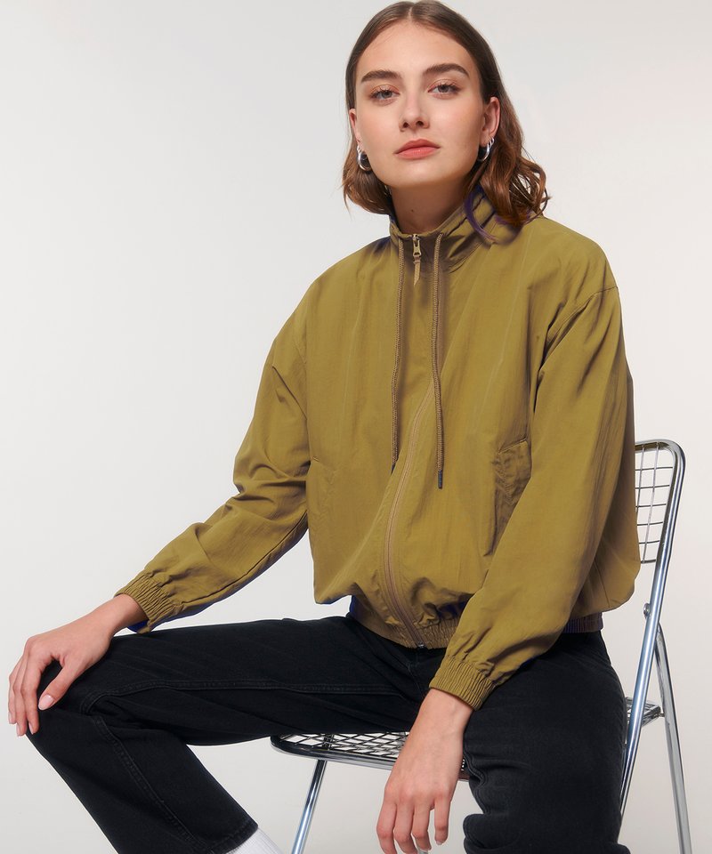 Elegant lightweight unisex recycled nylon tracksuit top designed for sports and casual wear, showcasing a luxurious fit.