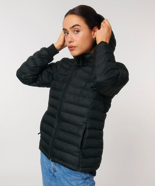 Luxury women's recycled polyester puffer jacket featuring a removable hood and adjustable fit, ideal for winter outings.
