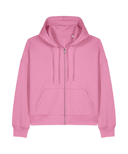 Stylish woman wearing the Luxury Organic Cotton Dropped Shoulder Zipped Hoodie, demonstrating versatile styling options for casual and elevated looks, zipped up over a chic outfit.