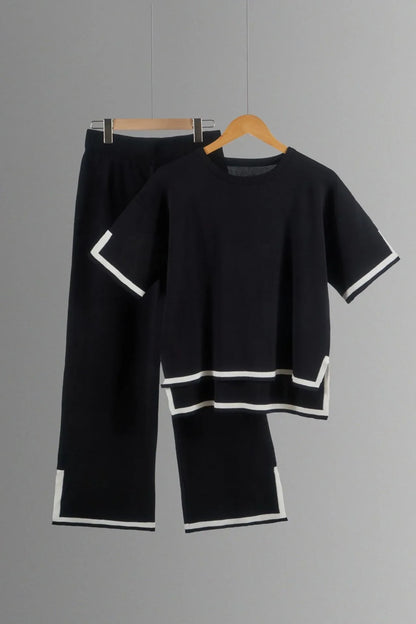 Close-up view of luxurious polyester and cotton fabric of an elegant women's knitted trousers suit, showcasing the rich texture and quality craftsmanship.