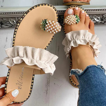 Fashionable Women's Pineapple Pearl Flat Toe Sandals displayed against a vibrant backdrop, embodying bohemian flair and comfortable luxury for any summer occasion.