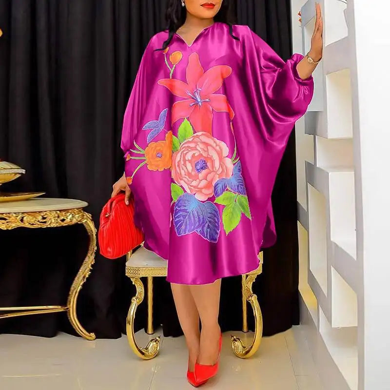 Stunning view of the Plus Size 5XL VONDA Women’s Bohemian Floral Midi Dress showcasing vibrant floral patterns, ideal for summer parties and holiday gatherings.