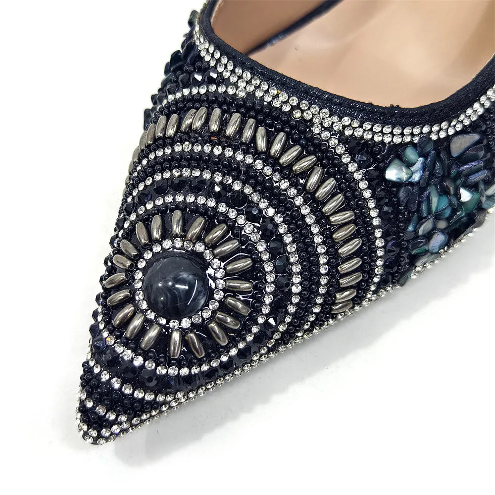 Close-up of exquisite pointed toe pumps, designed for comfort and elegance, featuring crystal embellishments and high spike heels for a touch of glamour.