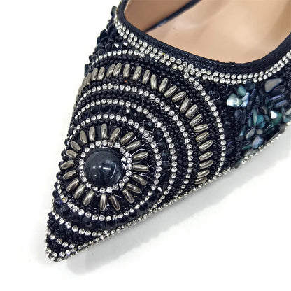 Close-up of exquisite pointed toe pumps, designed for comfort and elegance, featuring crystal embellishments and high spike heels for a touch of glamour.