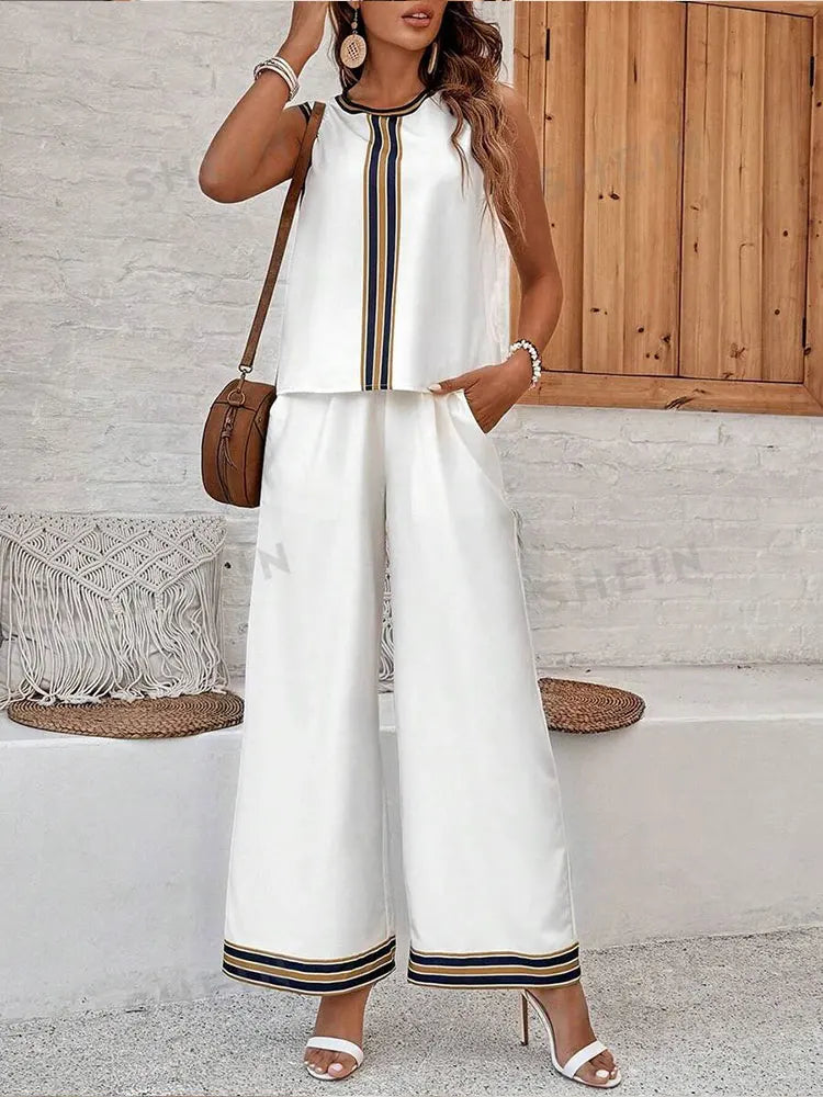 Luxurious women's casual sleeveless top and elegant wide leg pants set, showcasing fine chiffon fabric in a stylish summer outfit.