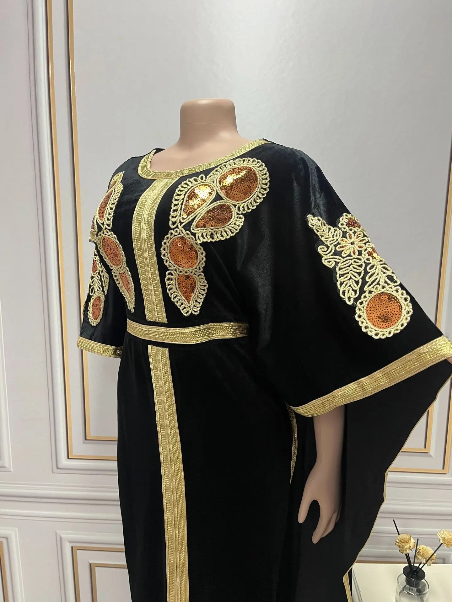 Full view of the loose-fit Golden Velvet Abaya designed for Muslim women, featuring a crew neckline and bat sleeves.