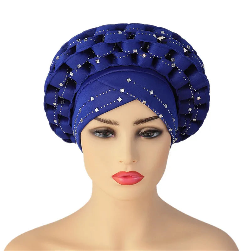 Fashionable woman accessorised with a stunning African Autogele headtie turban cap, radiating glamour and traditional beauty.