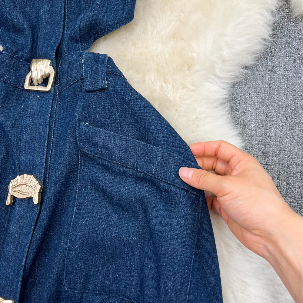 Close-up of luxurious polyester fabric of the sleeveless denim dress, showcasing its refined texture and elegant silhouette.