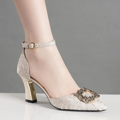Chic women's pumps showcasing a stylish buckle closure, elegant pointed toe, and delicate thin heels, perfect for sophisticated party occasions.