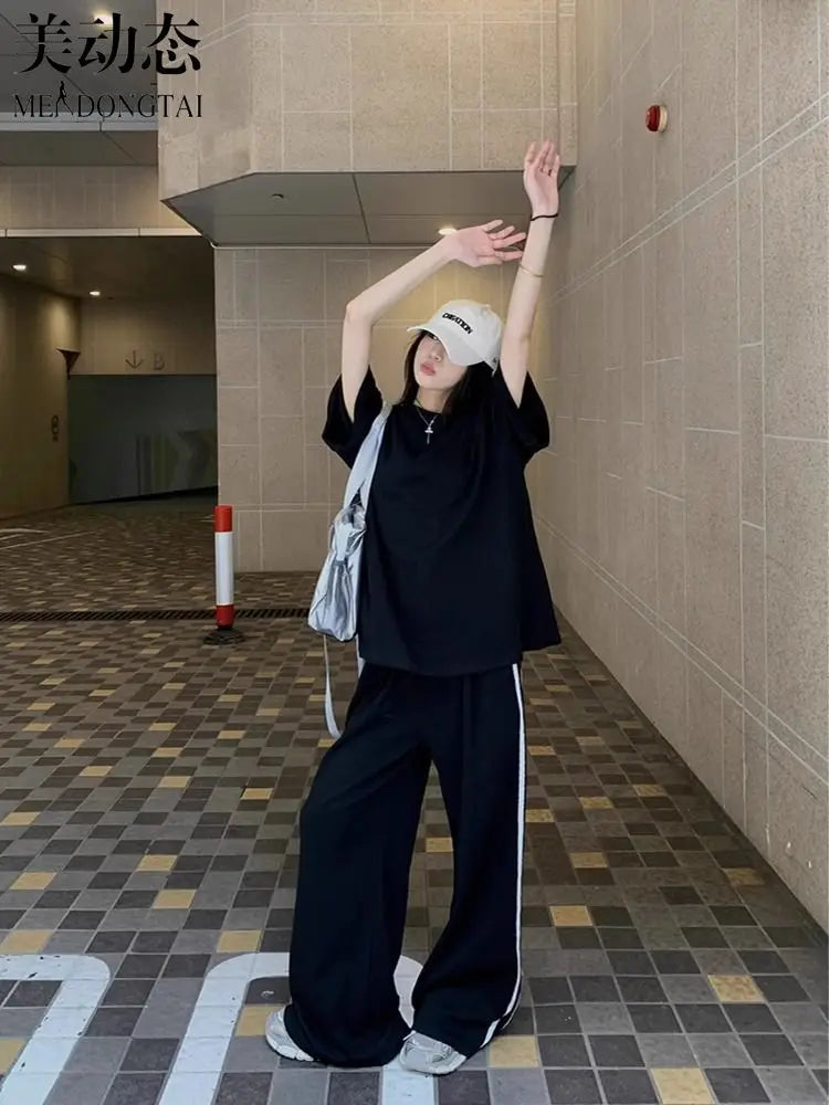 Luxury women's casual two-piece set featuring a striped short sleeve T-shirt paired with high-waisted wide leg pants in a stylish and comfortable design, suitable for various occasions.