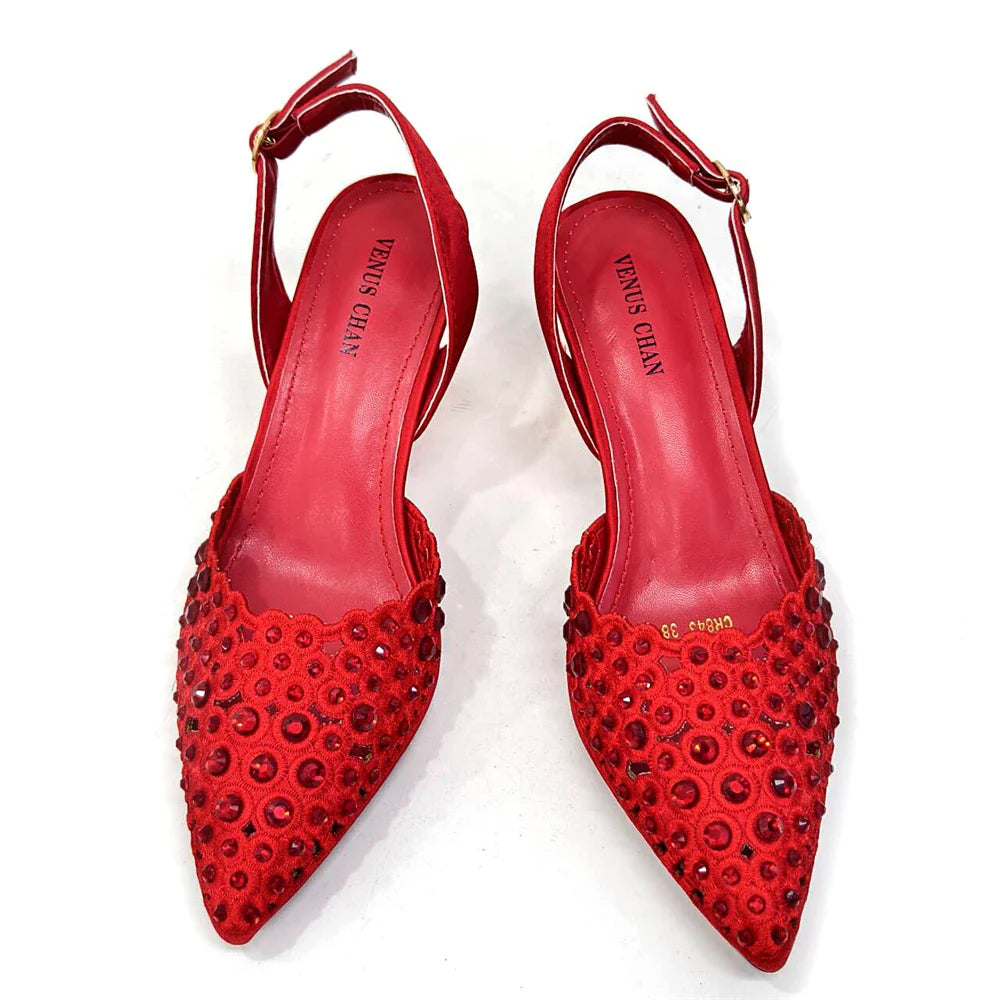 Close-up of Venus Chan high heel shoe, featuring intricate rhinestone embellishments and vibrant gold colour, designed for women who love luxury.