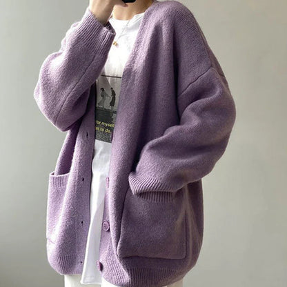 Sophisticated women's V-neck cardigan in vibrant yellow, accentuating a chic minimalist style for casual and elegant occasions.