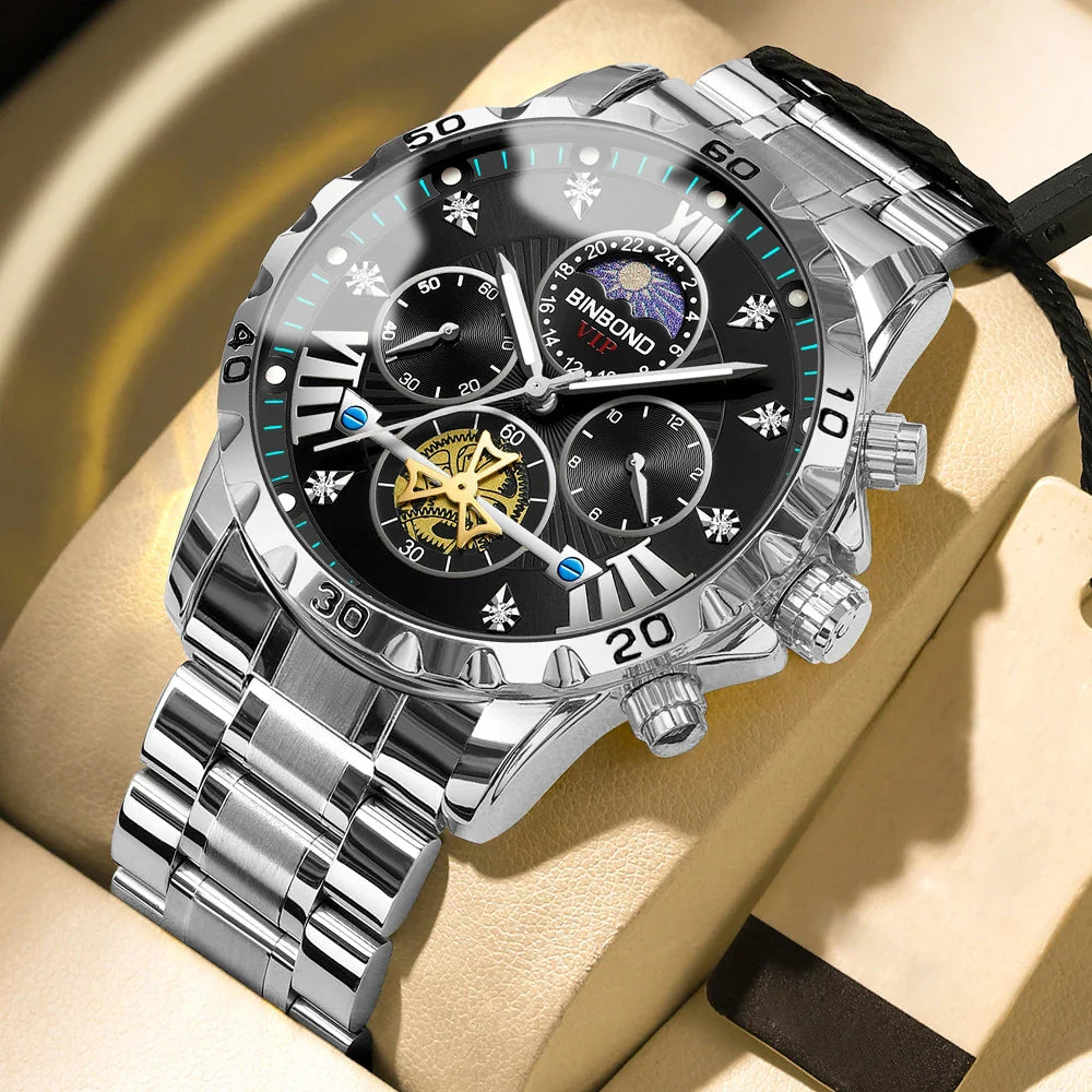 Close-up detail of the luxury men's quartz watch face, displaying Roman numerals, chronograph sub-dials, and luminous hands against a sleek stainless steel backdrop.