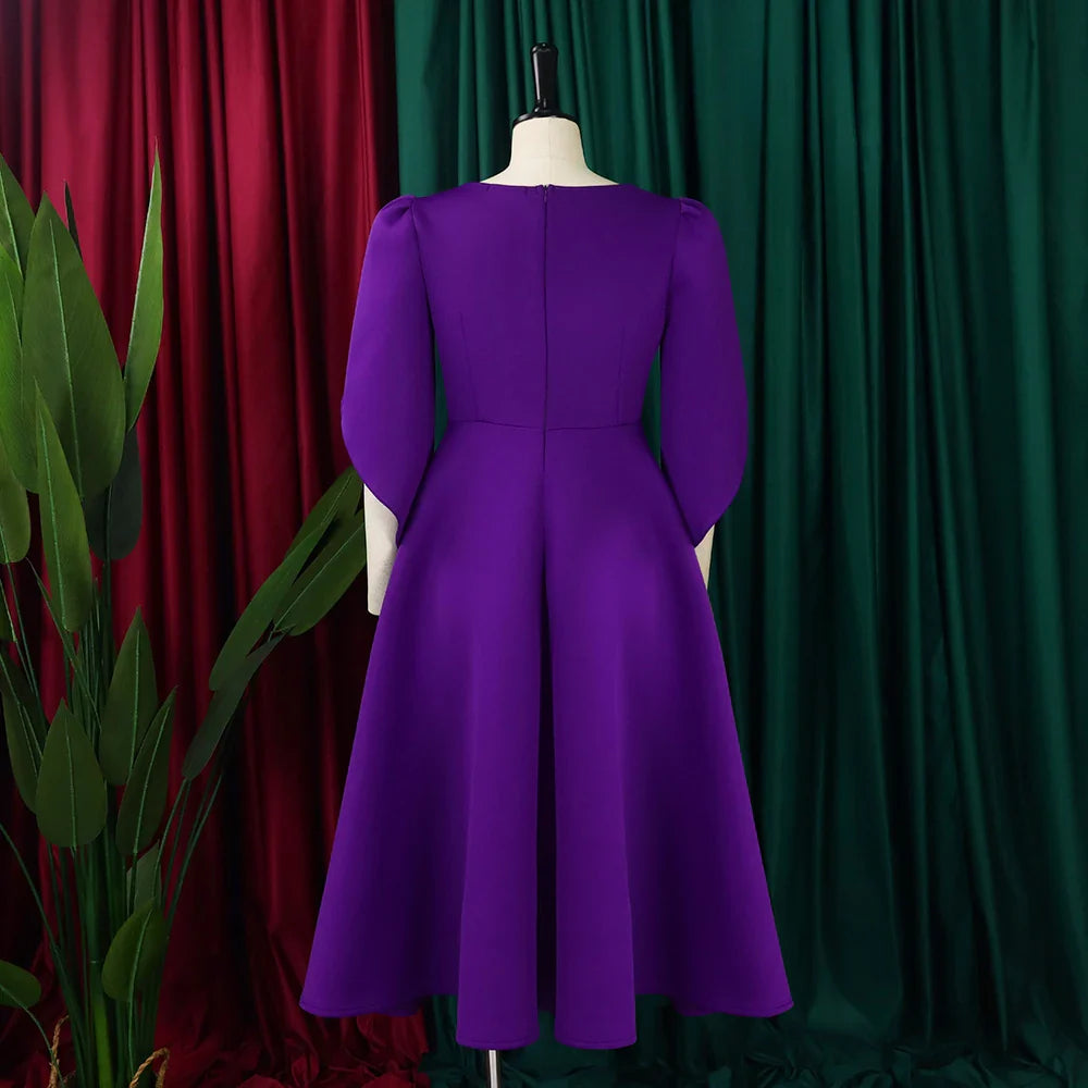 Elegant pleated dress displayed on a mannequin, showcasing the flattering high-waisted structure and sophisticated design crafted for middle-aged women.