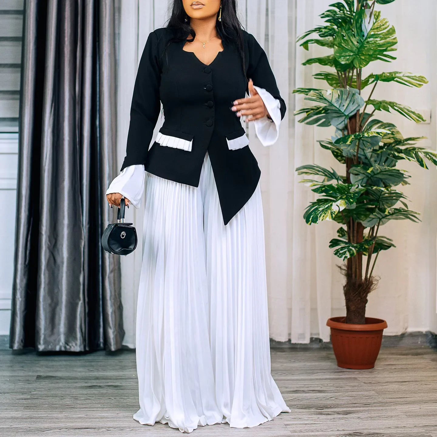 Stylish ensemble featuring CM.YAYA Women's Plus Size Flare Sleeve Blazer and Wide Leg Pants, ideal for the fashionable professional seeking a luxurious wardrobe.