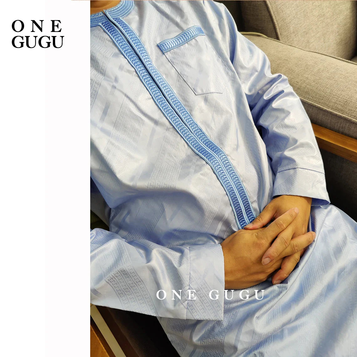 Close-up of the exquisite Jacquard pattern on the premium blue African Dashiki shirt and pants set, highlighting quality craftsmanship.