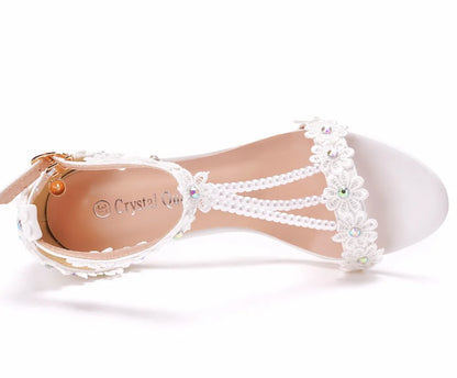 Stylish high heel gladiator sandals for women in plus sizes, showcasing intricate lace flower details and a luxurious design ideal for dressy events.