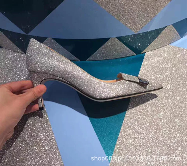 Close-up of luxury pointed toe stiletto heels adorned with sparkling sequins, perfect for glamorous occasions.