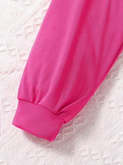 Stylish display of the round neck top from the girls' autumn fashion set, designed for comfort and elegance in ages 7-13.