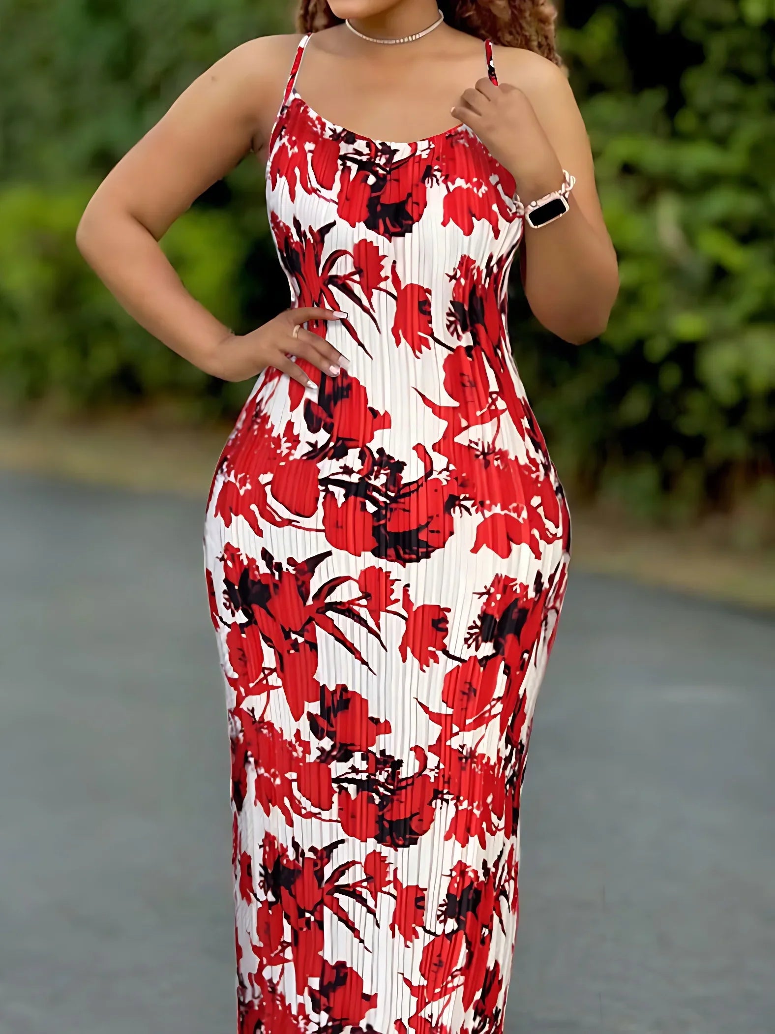 Luxury women's summer dress with tie dye pattern, pleated detailing, and spaghetti straps, ideal for beach wear.