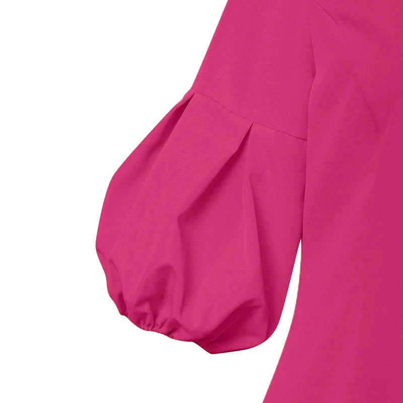 Versatile green maxi dress for women, featuring three-quarter lantern sleeves and a sophisticated fit, perfect for both casual outings and upscale gatherings.