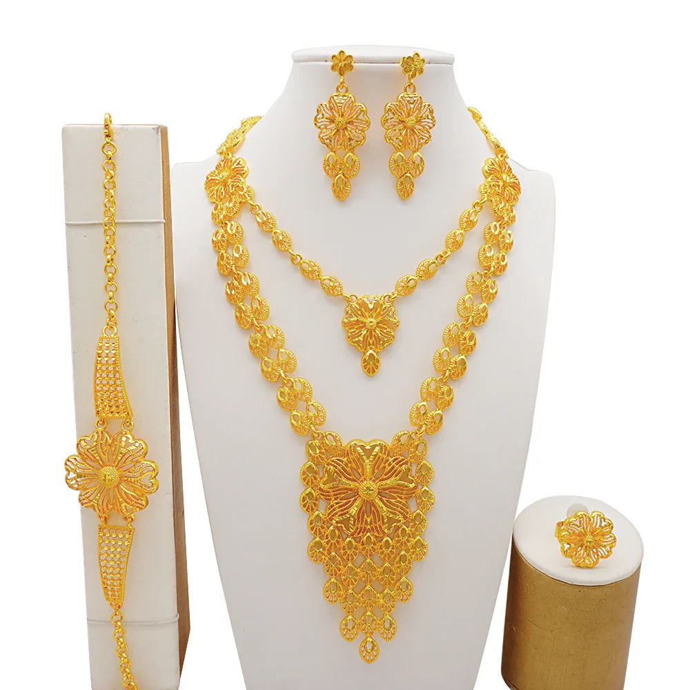 Complete luxury jewelry set including necklace, earrings, bracelet, and ring in gold colour, featuring African-inspired design for women.