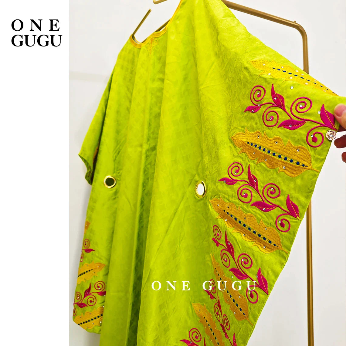 Close-up of embroidery lace and decorative stones on a Luxury African Bazin Riche Boubou Dress for women.