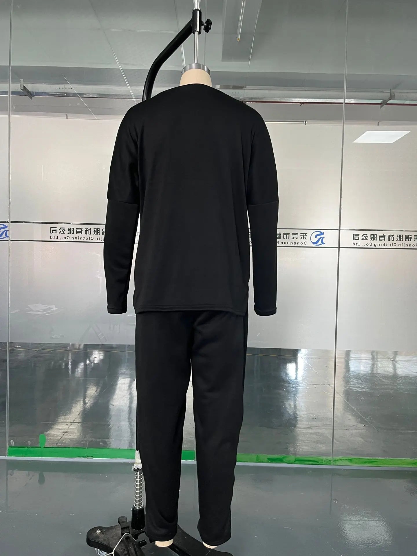 Trendy women's full sleeve top and midi waist pants ensemble, featuring a polished look with practical pockets, perfect for modern elegant styling.