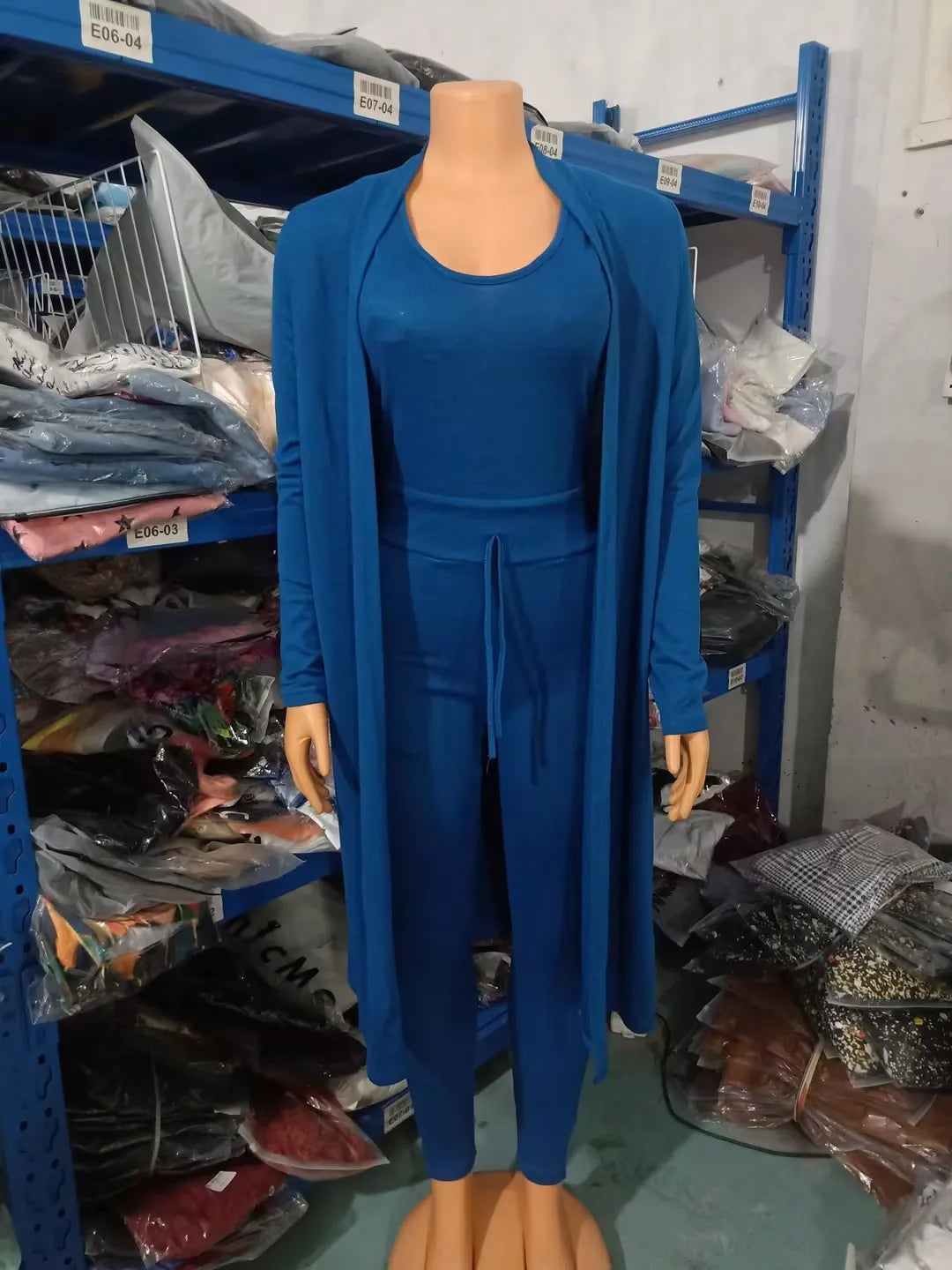 Sophisticated high waist women's jumpsuit with drawstring pockets, showcasing a sleek and modern silhouette ideal for autumn fashion.