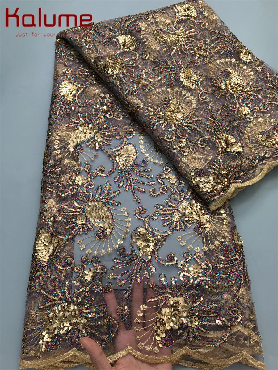 Vibrant party-ready Kalume lace fabric showcasing intricate designs, tailored for elegance and upscale events.