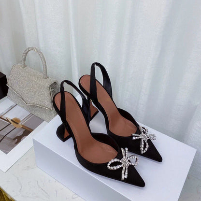 Elegant women's stiletto heels sandals with thin heels and a sophisticated bow, made from silk, ideal for summer soirées.