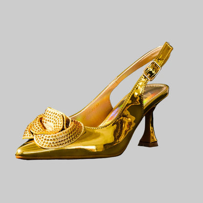 Close-up of luxurious high heel pumps with ankle straps, designed for women seeking chic footwear for parties and formal events.