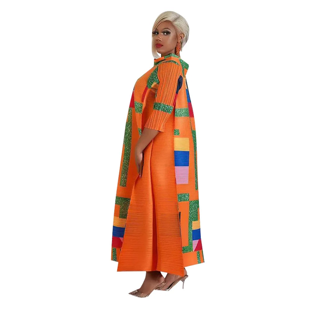 Front view of the Plus Size Long Dress with pleats and 3/4 sleeves, featuring colourful African patterns, ideal for cultural celebrations.