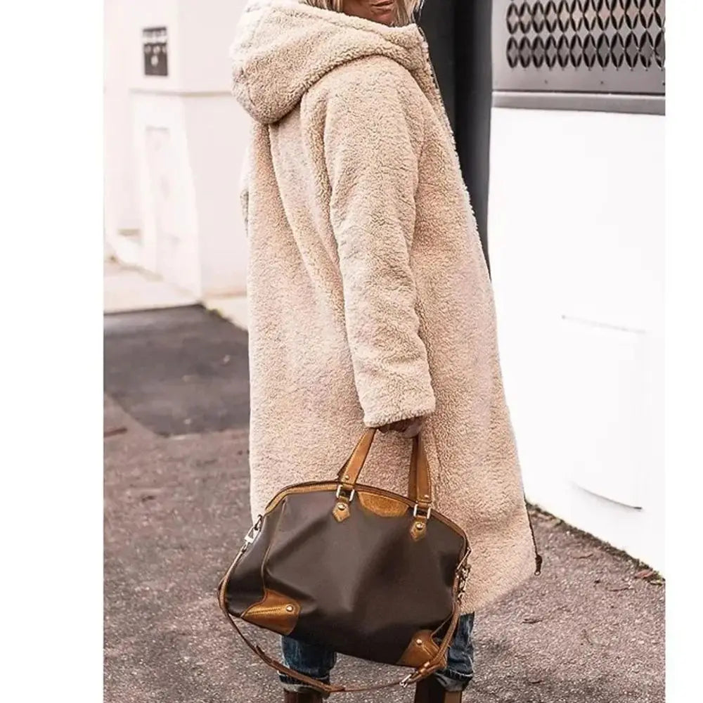 Elegant long sleeve winter jacket for women, featuring a stunning quilted design and practical pockets.