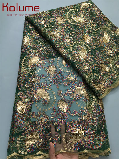 Exquisite polyester and cotton mesh lace fabric featuring vibrant sequins, perfect for crafting sophisticated party attire.