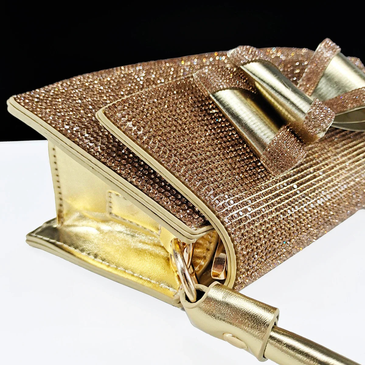 Stylish long chain shoulder bag matching the elegant women's rhinestone butterfly shoes, perfect for formal events.