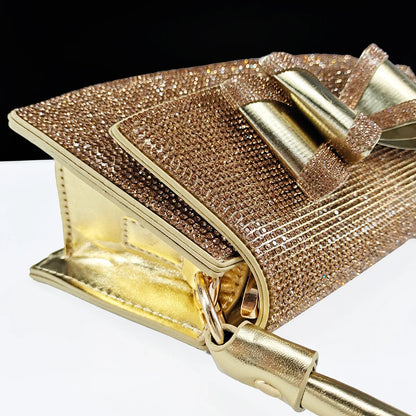 Stylish long chain shoulder bag matching the elegant women's rhinestone butterfly shoes, perfect for formal events.