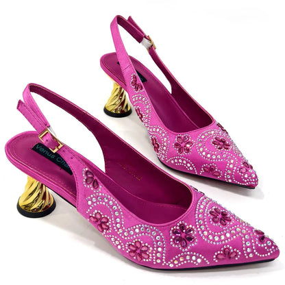 Close-up of the pointed toe of premium fuchsia pumps featuring sparkling rhinestones, embodying both glamour and comfort for special occasions.