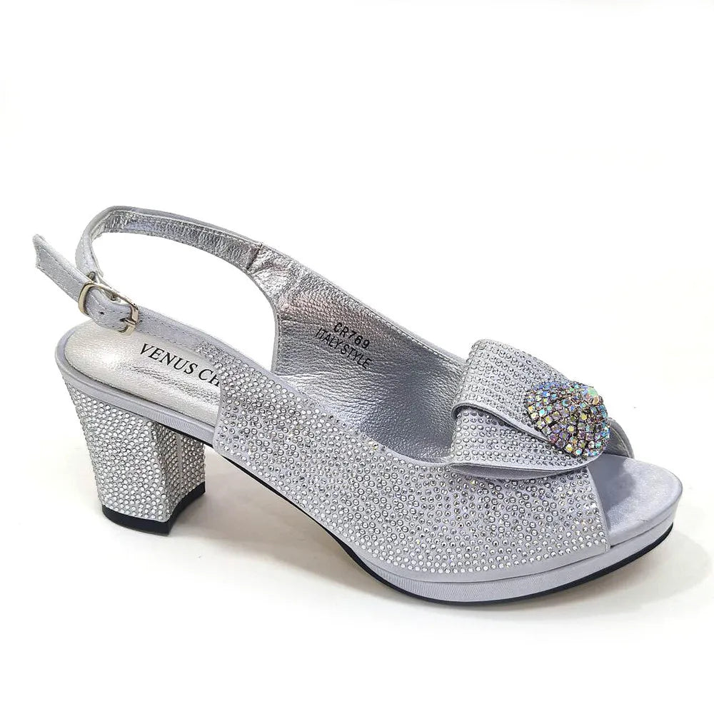 Elegant golden wedding bag crafted to match Venus Chan high spike heels, featuring intricate bling detailing.