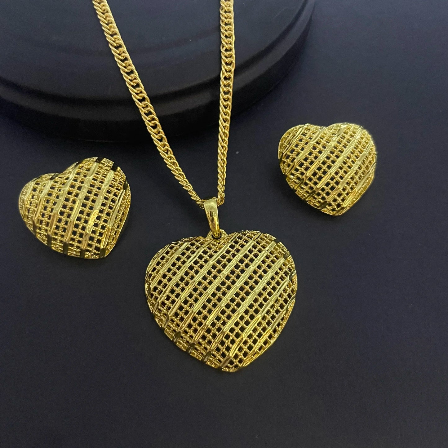 Exquisite 24K gold-plated copper jewelry set displayed elegantly, ideal for women seeking fashionable and luxurious accessories.