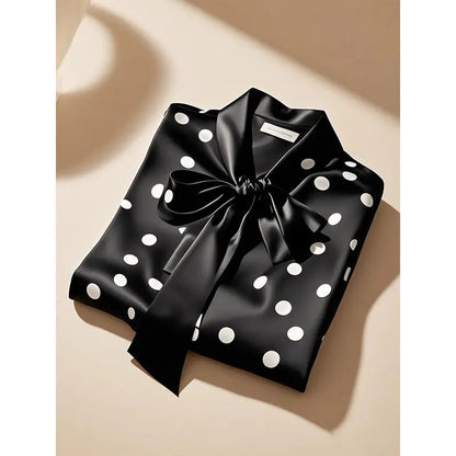 Chic office top for women, featuring long sleeves and a classic polka dot print in soft satin fabric.