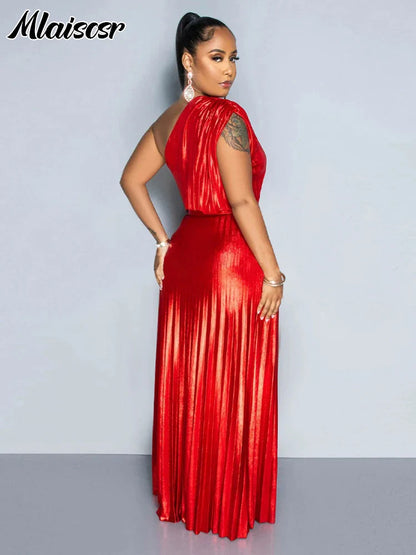 Side profile of a woman wearing a one-shoulder metallic gold evening dress, highlighting the elegant silhouette and stylish design.