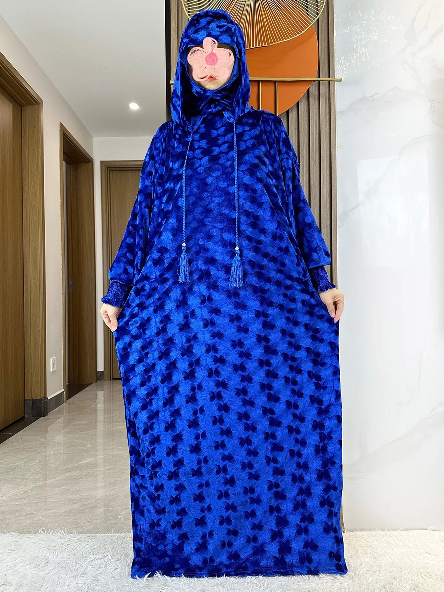 Sophisticated loose fit abaya made of high-stretch velvet, perfect for adult women seeking elegance and comfort.