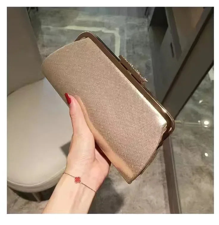 Close-up of the exquisite diamond decoration on a ladies' luxurious clutch bag, ideal for upscale events.