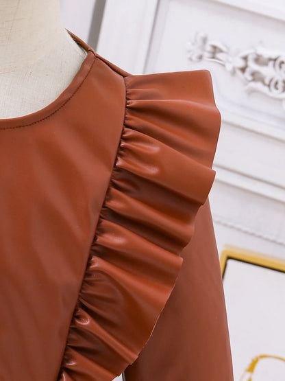 Fashionable girls' autumn outfit displayed on a neutral background, showcasing the knee-length dress and elegant vest set.