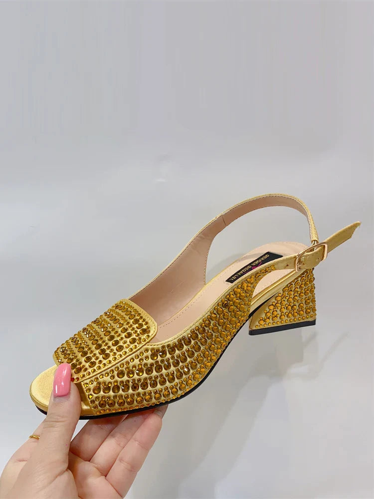Luxurious bling gold peep toe women's pumps featuring a cross-tied style and high square heel for an elegant touch to any outfit.